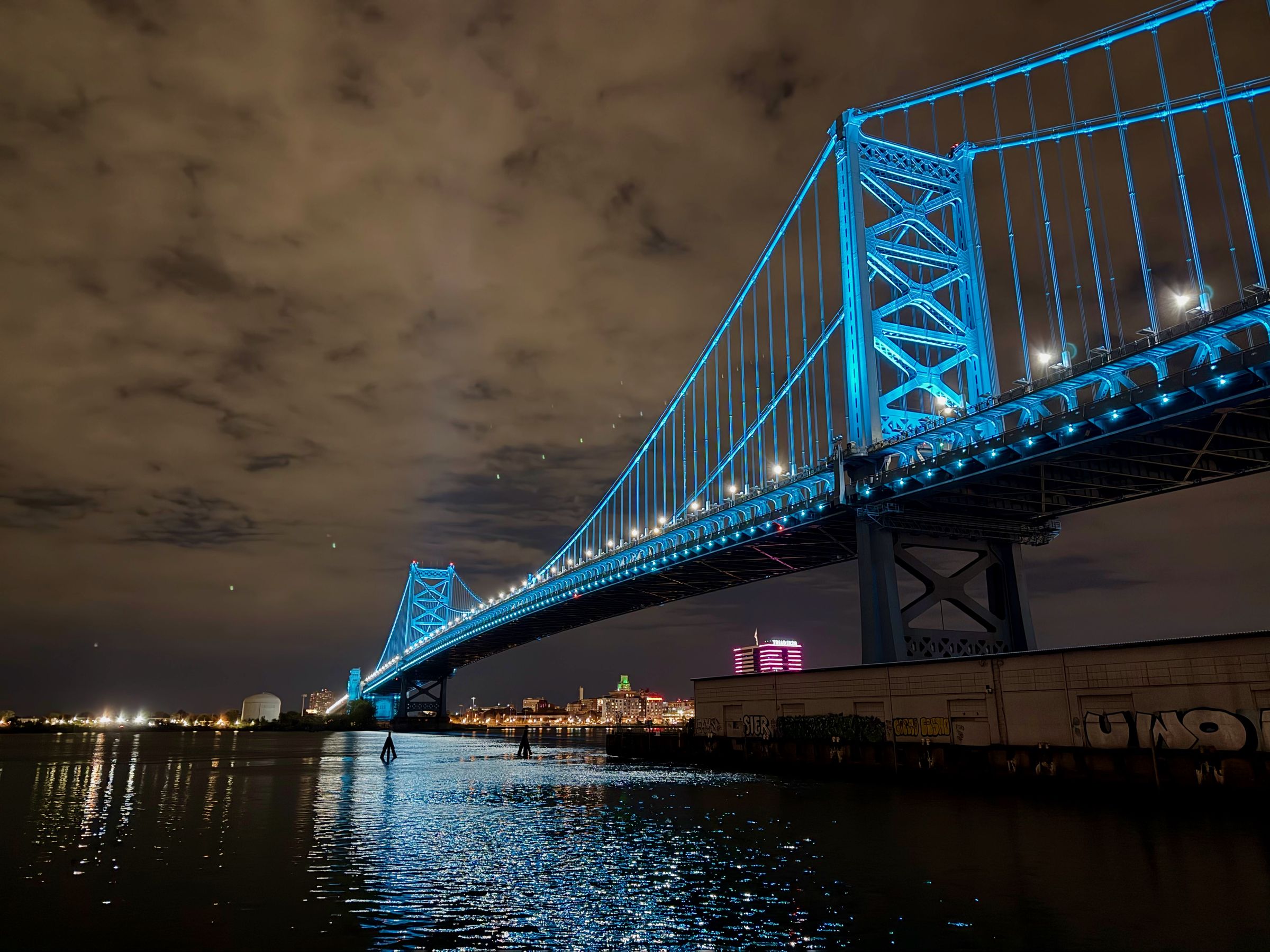 Benjamin Franklin Bridge all lit up at night.